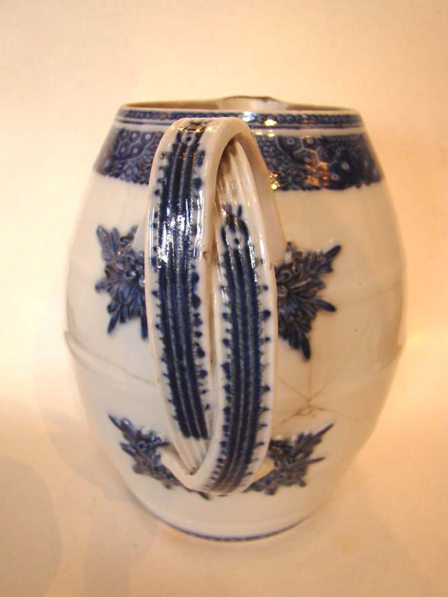 A late 18th century Chinese Export Porcelain Cider Jug with condition issues — image 4